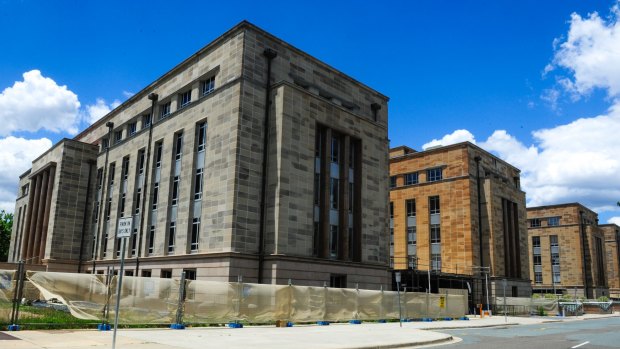 The bill for the John Gorton building renovations has topped $8 million amid payment disputes between contractors.