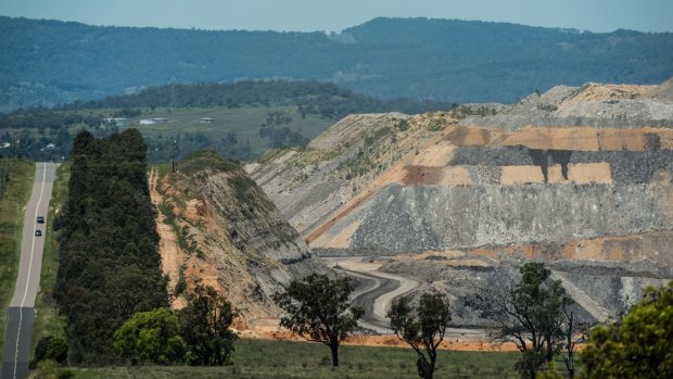 An open-cut coal mine looms over Muswellbrook.