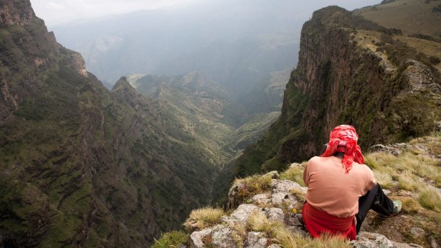 Hiker at the esarpment edge in the Simien Mountains.