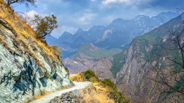 Hiking path (the high road) of Tiger Leaping Gorge. Located 60 kilometres north of Lijiang City, Yunnan Province, China. 