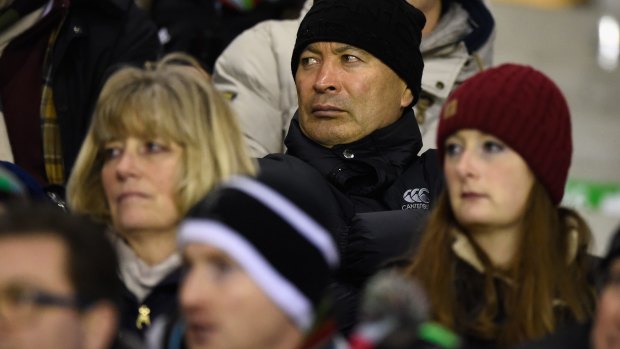 Keeping a low profile: Eddie Jones watches Harlequins take on Leicester Tigers in the stands last weekend.