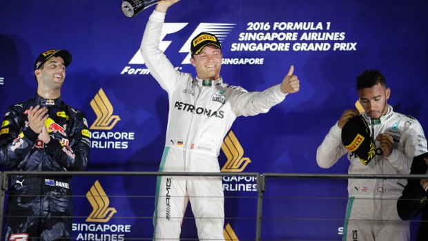 Mercedes driver Nico Rosberg of Germany celebrates after winning the Singapore Formula One Grand Prix on the Marina Bay City Circuit Singapore.