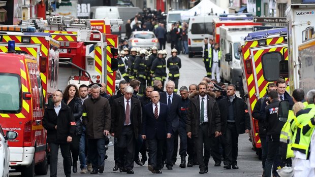 French Interior Minister Bernard Cazeneuve visits Rue de la Republique in Saint-Denis, France, after the shootout there on November 18.