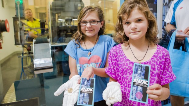 Sydney sisters Emalee 11, and Chelsea Olbrich 8, were among the first to receive the new coins on January 1.