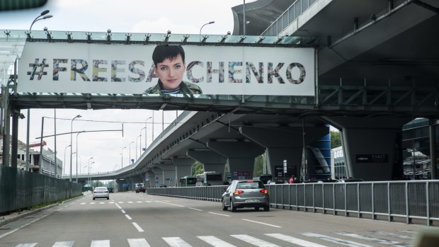 A sign advocating the release of Ukrainian military pilot Nadiya Savchenko hangs at  Boryspil Airport, where she landed after being released from Russian custody.