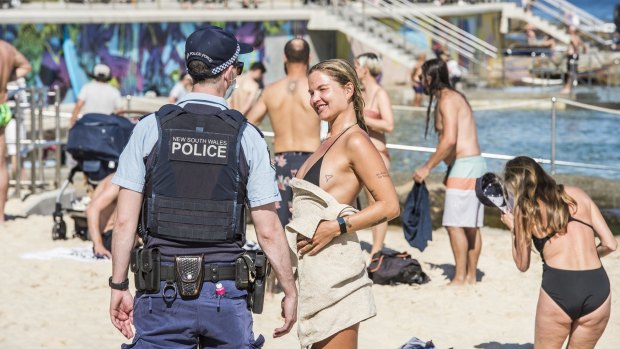 Police patrol Bondi Beach during COVID-19 restrictions last year.