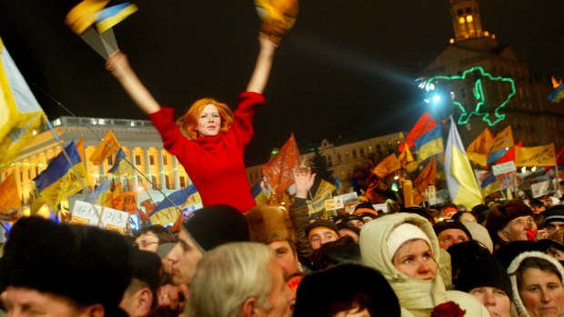Supporters of Ukrainian opposition leader Viktor Yushchenko celebrate at a rally in the main square of Kiev in December 2004.