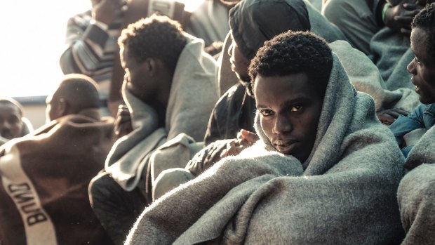 Migrants arrive at the Trapani harbour, southern Italy.