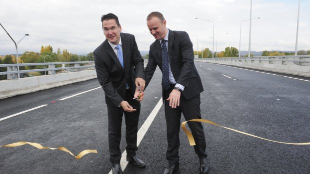 At the official opening of the Malcolm Fraser Bridge, part of the Majura Parkway project, Senator Zed Seselja, left, and ACT Chief Minister Andrew Barr cut the ribbon.