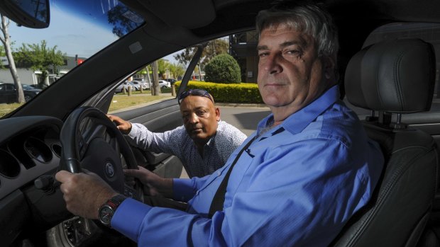 Prospective Uber drivers Teferi Gungul, left, and Gary Woodbridge will have their cars tested next week as Uber prepares to start operating in Canberra.