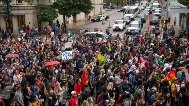 Anti-Trump protesters march along Congress Avenue in Austin, Texas, on Wednesday.