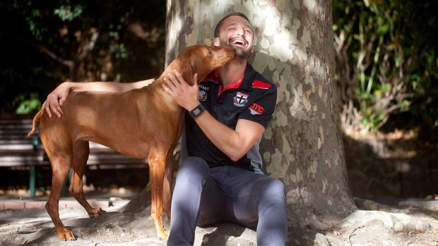 A dog's life: St Kilda footballer Jarryn Geary with his dog Lilly.