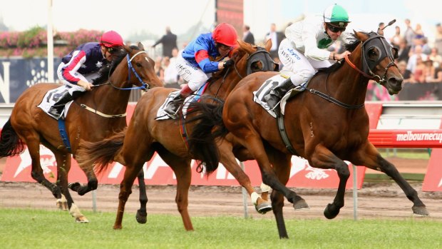 Jockey Peter Mertens​ rides Sirmione to victory in the Mackinnon Stakes in 2007.