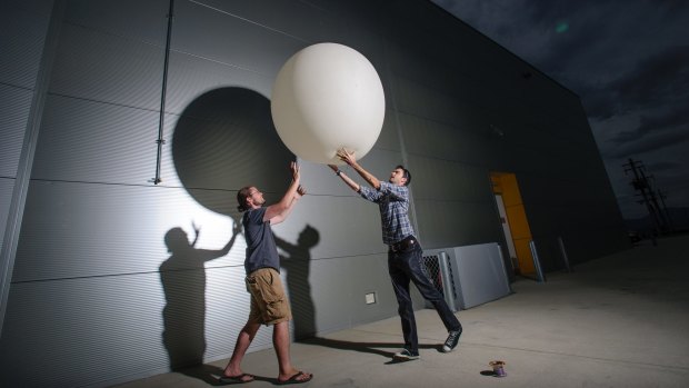 ANU astronomer Dr Brad Tucker and engineer Dr James Gilbert with one of their high altitude balloons. 