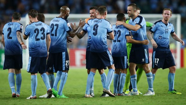 Up and down season: Sydney FC players celebrate their win over Guangzhou in the Asian Champions League at Allianz Stadium this month.
