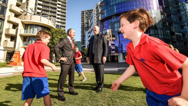 Education Minister James Merlino and Housing Minister and Albert Park MP Martin Foley with students from Port Melbourne Primary School.