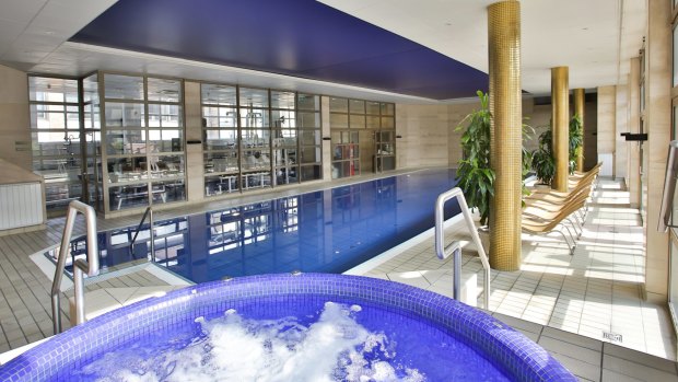 There's an indoor lap pool, with atrium-like glass windows which open onto a wide, sunny patio.