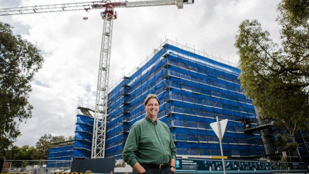 Dr John Manners, director of CSIRO Agriculture, in front of a new development site at the CSIRO Canberra.