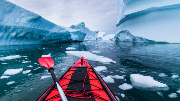 Kayaking in Antarctica between icebergs.