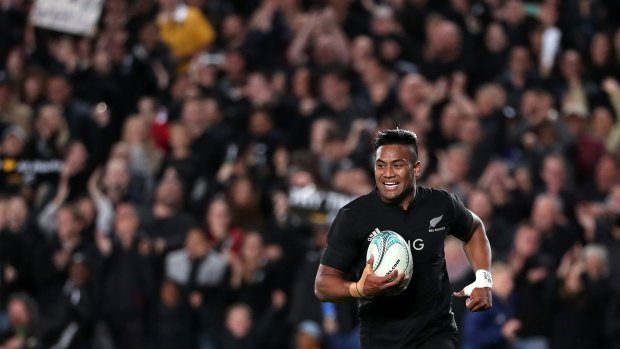 Bus route: Julian Savea scores another try against a sea of black.