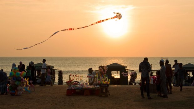 Go fly a kite at Galle Face Green at sunset.
