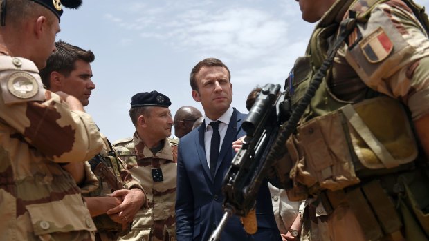 French President Emmanuel Macron talks to French soldiers in Gao, northern Mali in May.