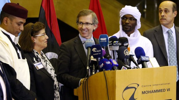 United Nations envoy for Libya Bernardino Leon, centre, announces the deal in Skhirat, Morocco, on Thursday.