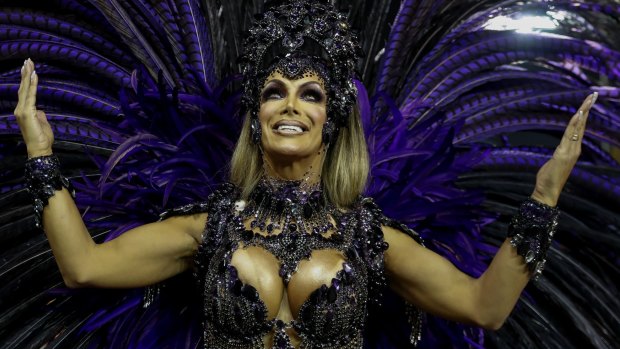 Transgender godmother Camila Prins poses for pictures prior to performing for Colorado do Bras samba school in Sao Paulo.