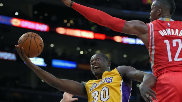 Shattering debut: Julius Randle goes up for a shot against Dwight Howard.