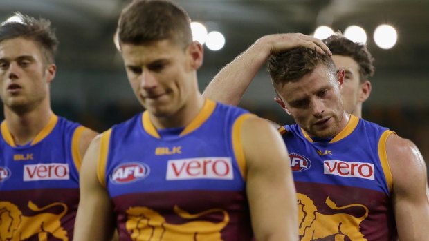 Despondent Lions trudge off the Gabba on Saturday night after a losing to the Dockers.
