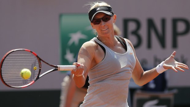 Croatia's Mirjana Lucic-Baroni returns in the second round match of the French Open tennis tournament against Romania's Simona Halep at the Roland Garros stadium, in Paris, France, Wednesday, May 27, 2015. Lucic-Baroni won in two sets 7-5, 6-1. (AP Photo/Christophe Ena)