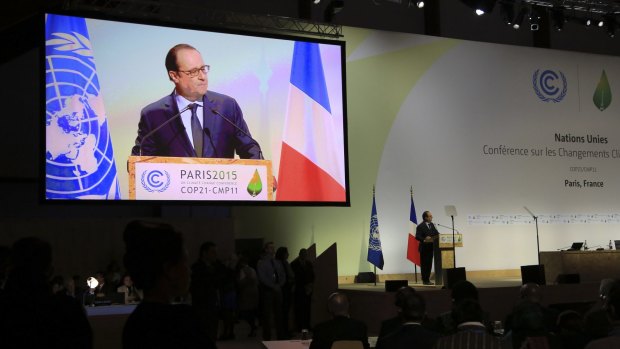 'Never have the stakes of an international meeting, and I say never, been higher' ... French President Francois Hollande speaks at the opening ceremony of the COP21.