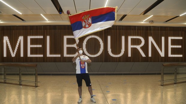 A fan of Serbia's Novak Djokovic in the arrivals hall at Melbourne Airport on Thursday.