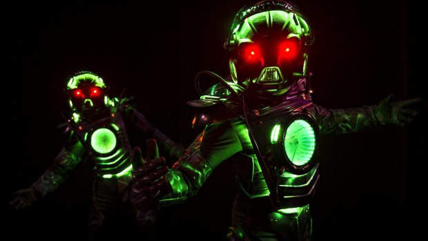 The show's dancing robots pose for a photograph.