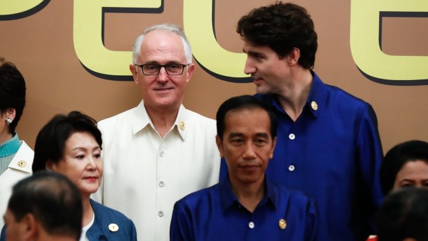 Australian Prime Minister Malcolm Turnbull and Canadian Prime Minister Justin Trudeau during the APEC Summit "family photo" in Da Nang, Vietnam, on Friday.