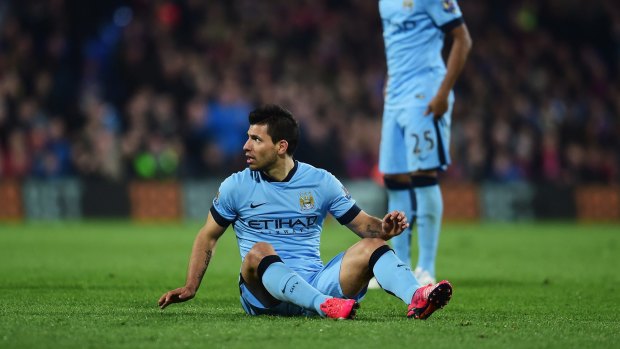 Down, and almost out: Sergio Aguero.