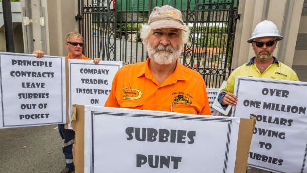 Subcontractor Barry Mitchell protests at the Eagle Farm redevelopment where two men were crushed to death, claiming he hasn't been paid for months.