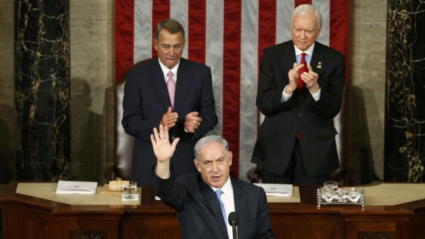 Israeli Prime Minister Benjamin Netanyahu (left) acknowledges applause at the end of his speech, which has sent the Israel-US relationship to a new low.