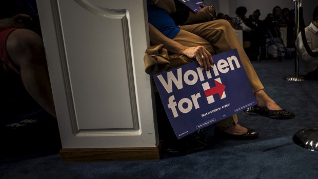 A woman holds a campaign sign at an event for Hillary Clinton in South Carolina in February. 