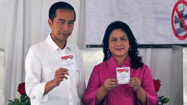 Indonesian President Joko Widodo and his wife Iriana cast their ballots. Ahok first became Jakarta's deputy governor on a ticket headed by Mr Joko.