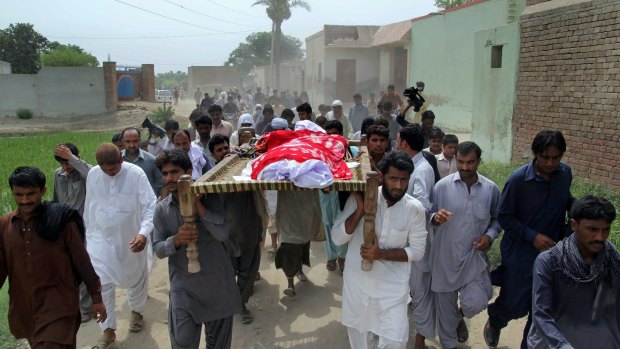 Relatives and local residents carry the coffin of slain model Qandeel Baloch for funeral prayers in Shah Sadar Din village, near Dera Ghazi Khan, Pakistan.