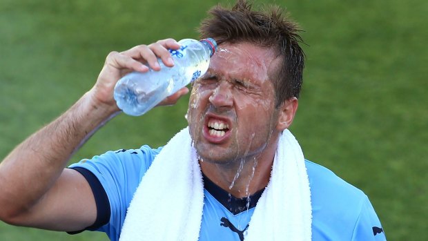 Heated: Sydney FC's Milos Dimitrijevic cools downduring the scorcher against Perth Glory.