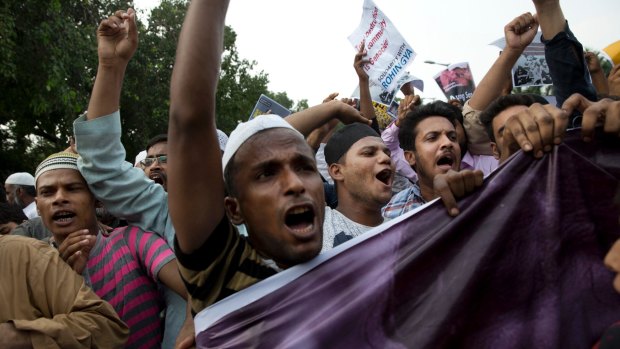 Indian Muslims shout slogans during a protest against the persecution of Rohingya Muslims in Myanmar, in New Delhi.