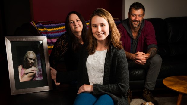 Kira Dart with a photo of her late mother, Bianca, aunt Carolyn Hullick and mental health advocate James Francis, a volunteer with the Black Dog Institute.