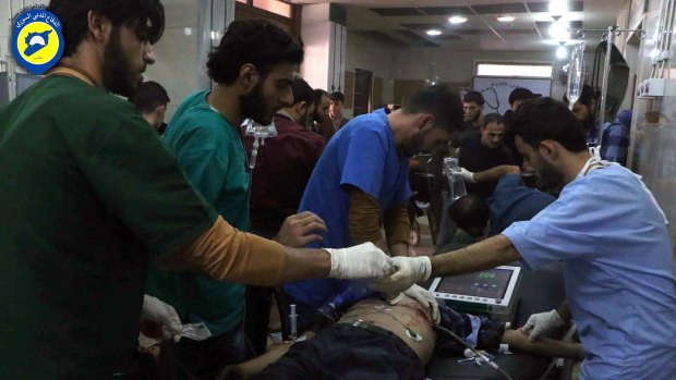 The wounded receive treatment at a local clinic after air strikes hit Aleppo, Syria, on Sunday.
