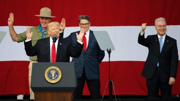 President Trump with Interior Secretary Ryan Zinke, left, Energy Secretary Rick Perry, centre, and Health Secretary Tom Price, all of them former Boy Scouts.