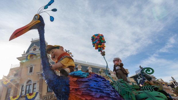 Characters from Up in the Pixar Play Parade.