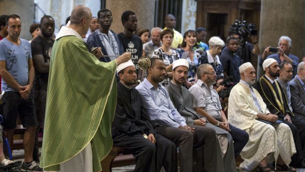 Muslims attend a Mass in Rome's Saint Mary in Trastevere church on Sunday.