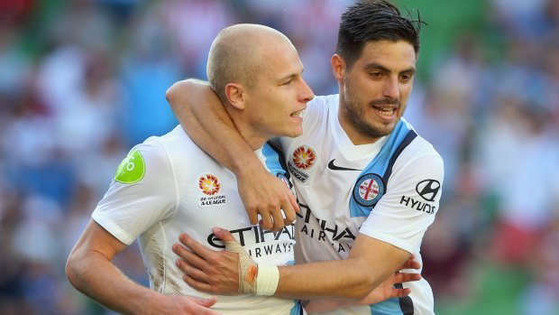 Strike force: Aaron Mooy celebrates with Bruno Fornaroli after scoring City's fourth.