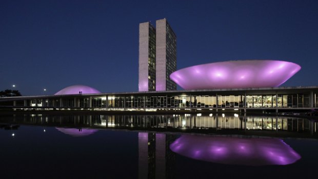 The National Congress illuminated at night in Brasilia, Brazil.